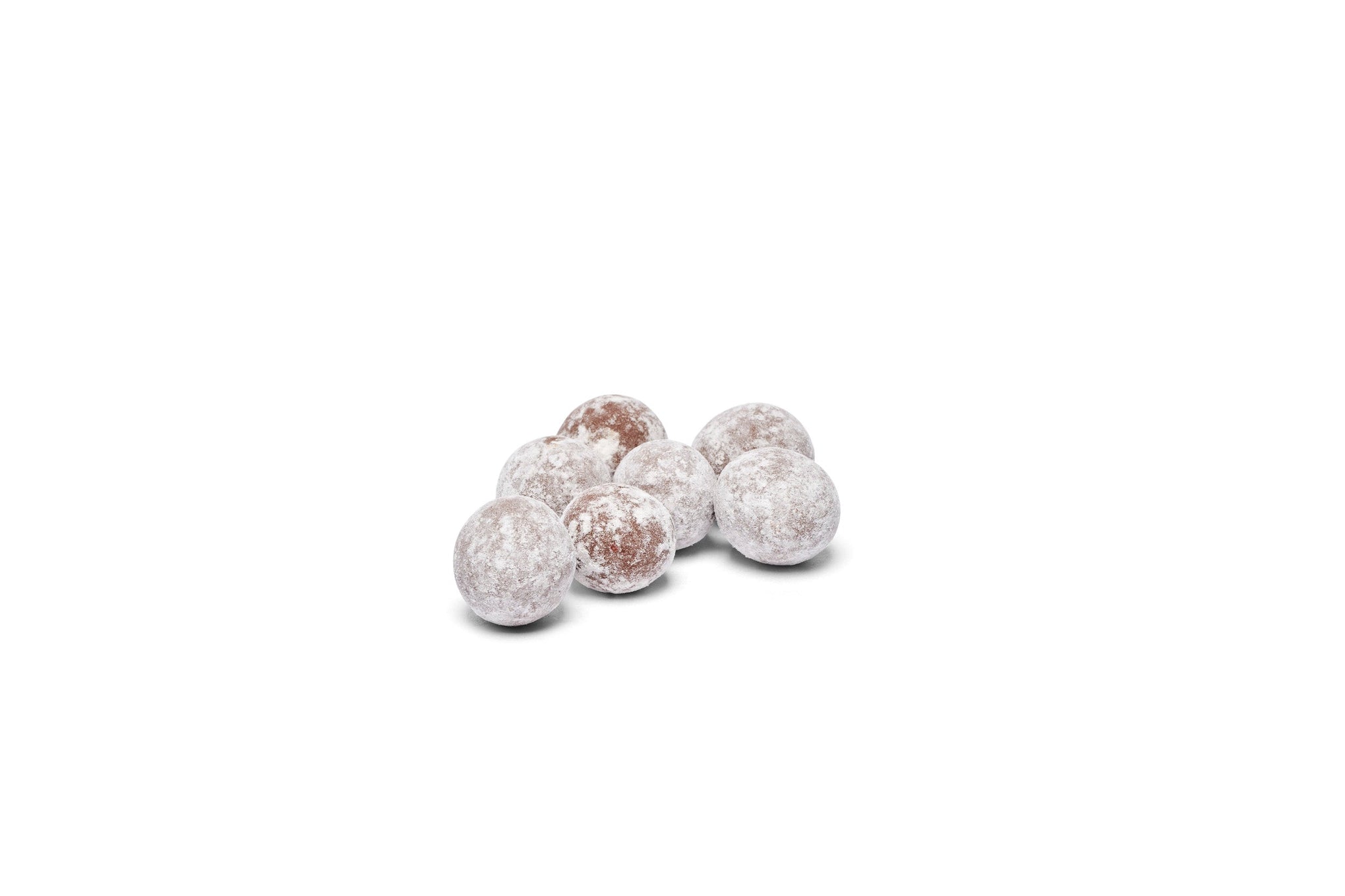 Dusted chocolate hazelnuts placed together